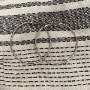 Never worn silver sparkly hoops